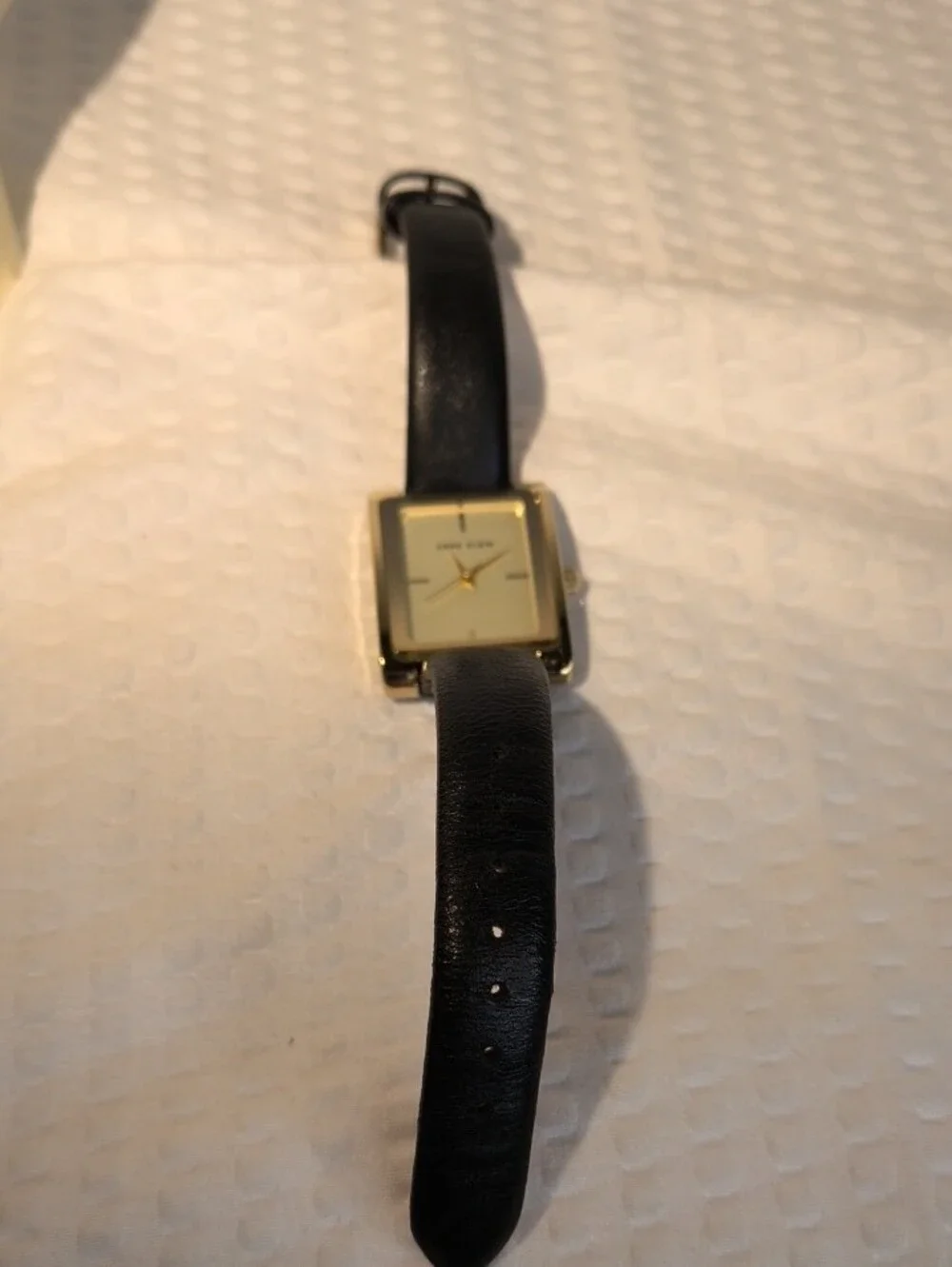 Anne Klein Women's Black Leather Strap Gold-Tone Rectangular Watch